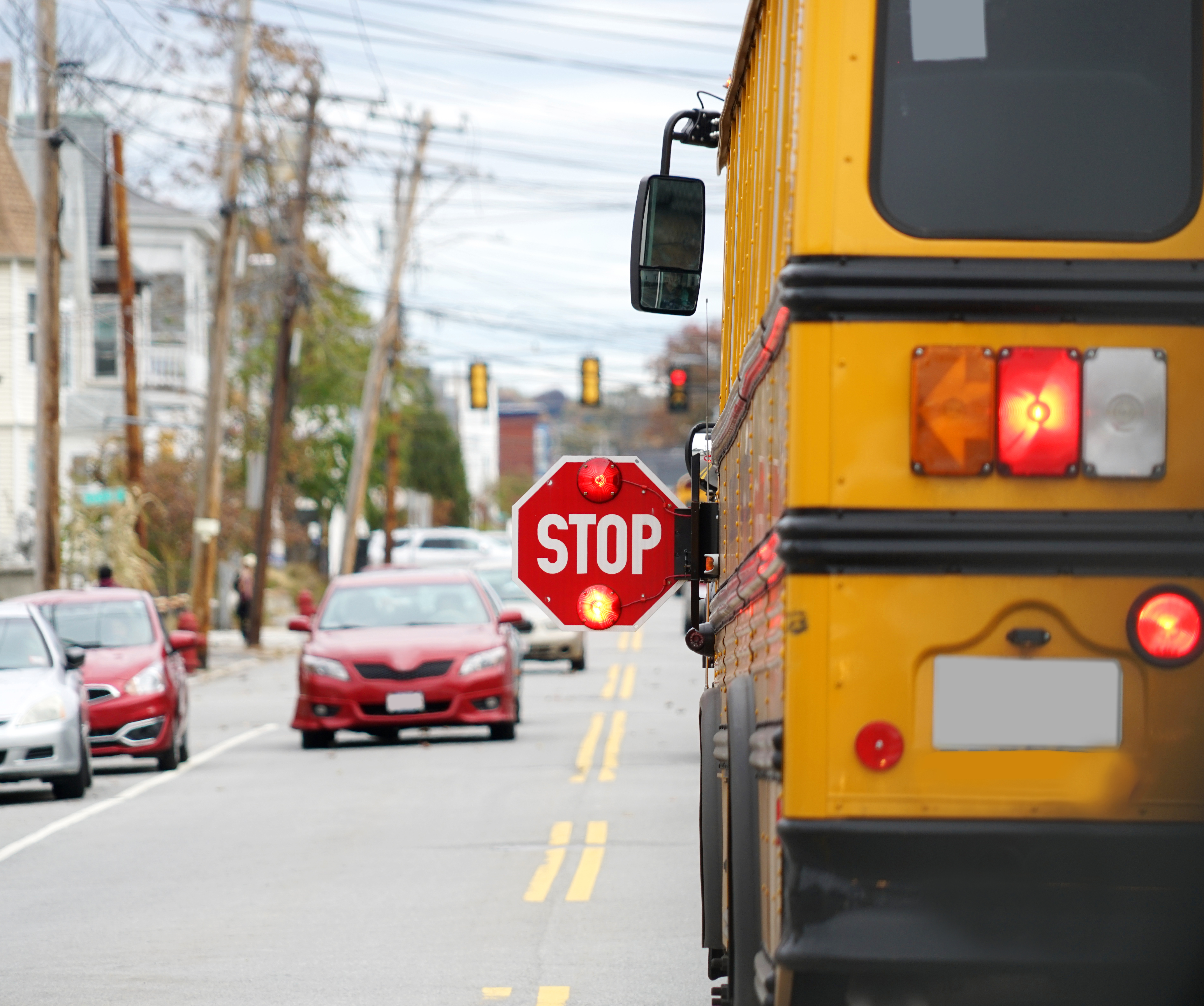 school bus with stop sign arm extended